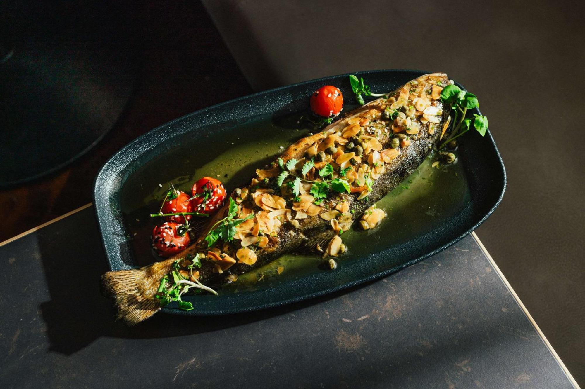 Hotel Hilton Vienna Plaza Esterno foto A whole turbot prepared with a Mediterranean sauce